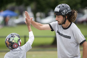 skateboarders giving each other a high five